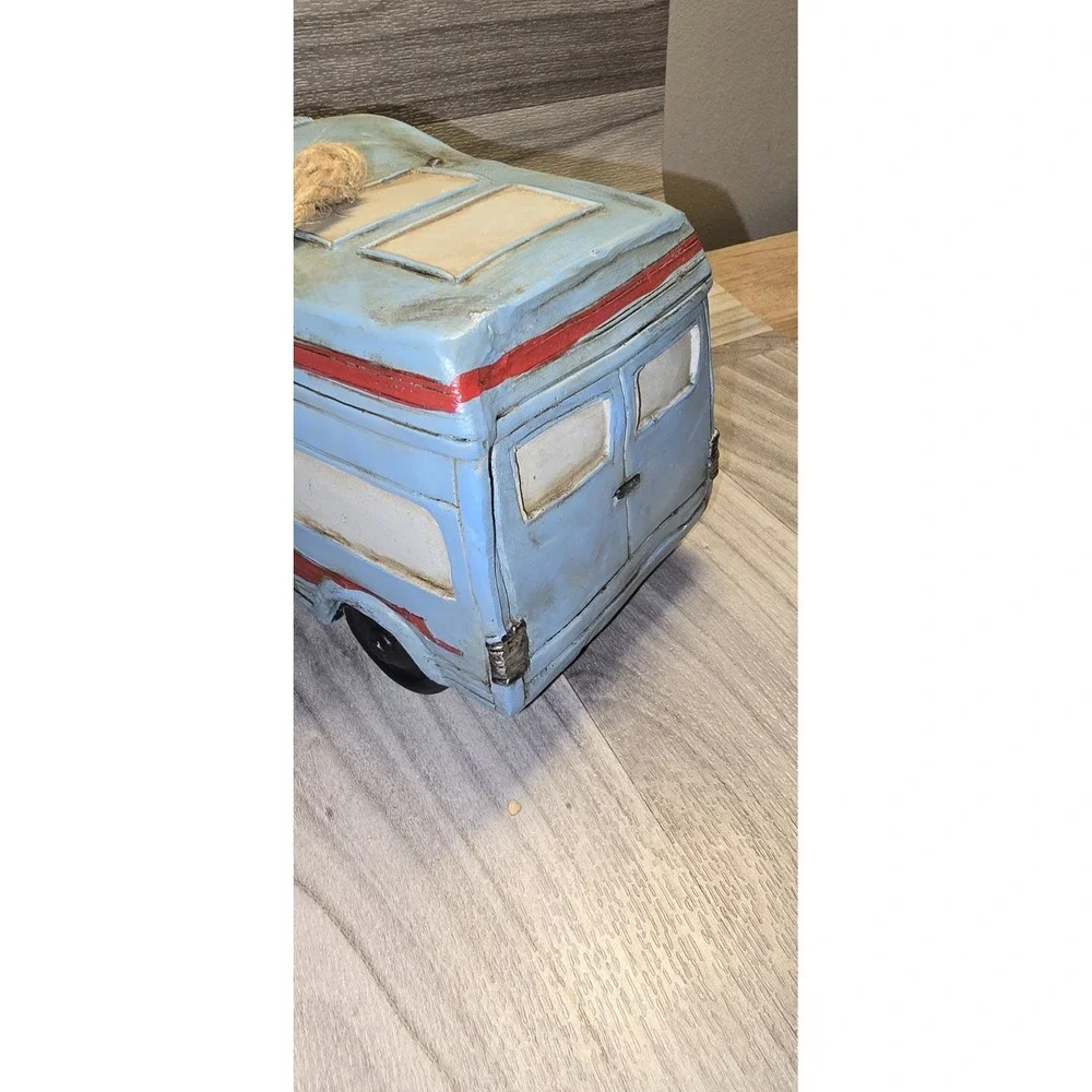decorative birdhouse designed to look like a retro RV camper van